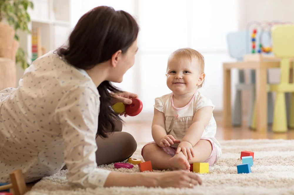 Premium babysitter caring for a child at home