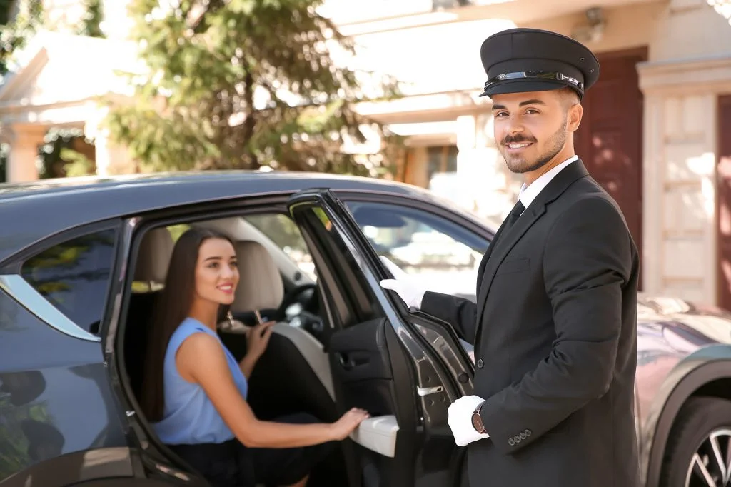 Office driver opening a car door for a client