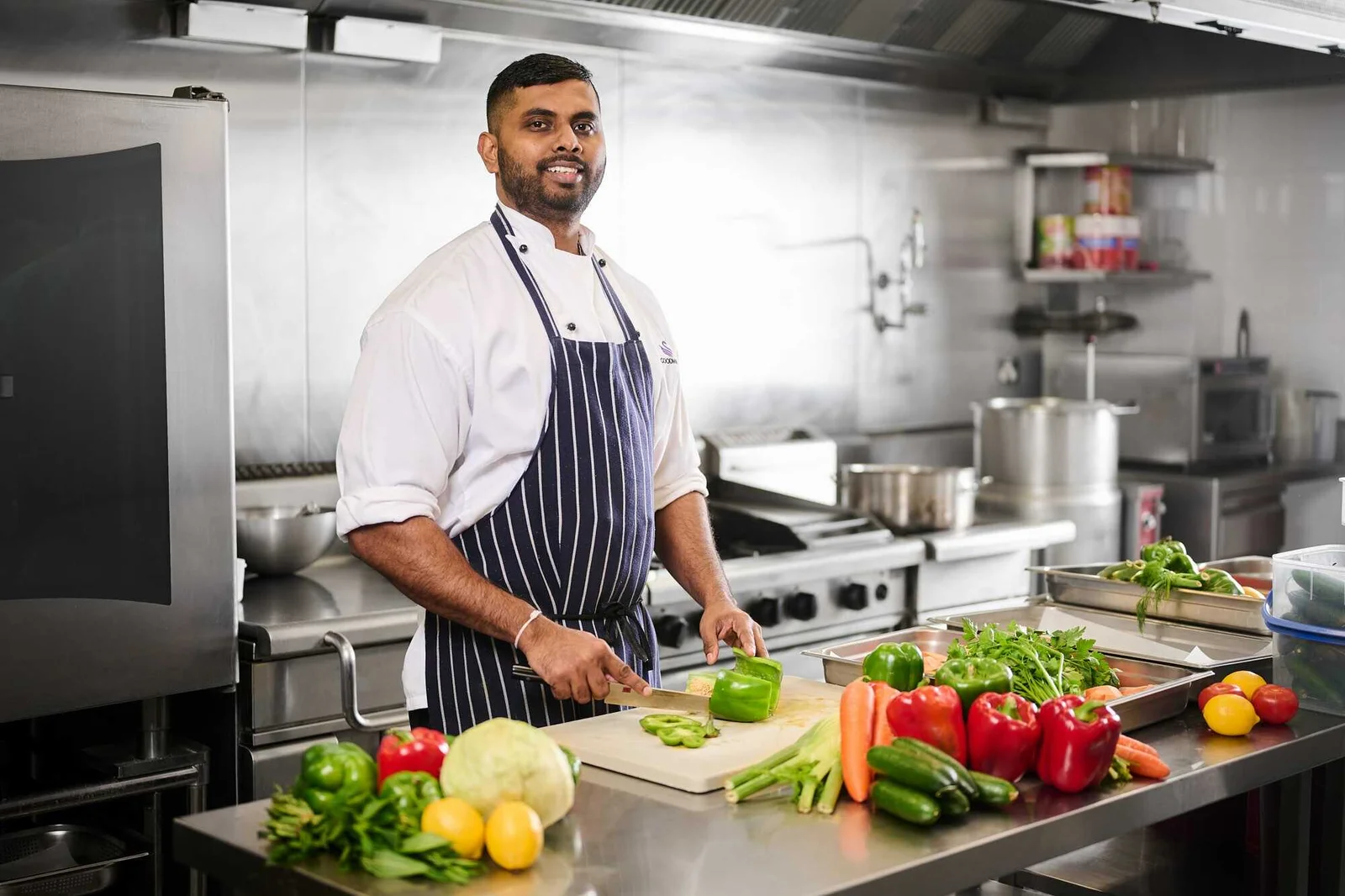 Cook preparing Pakistani and Chinese dishes